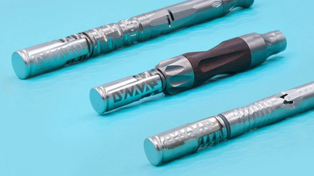 three vaporizer pens displayed on a light blue background