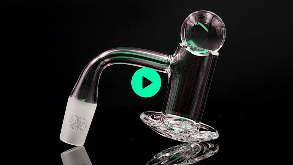 glass dab rig with a play button in it