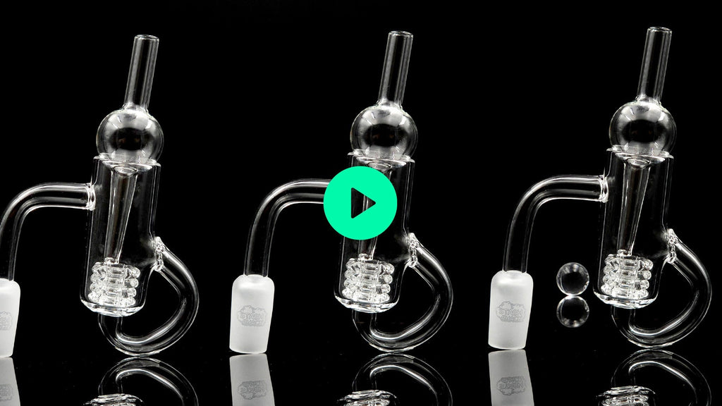 three clear glass quartz bangers on a black background