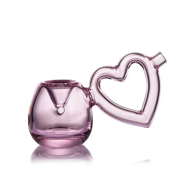 Pink glass pipe with a heart-shaped handle on a white background